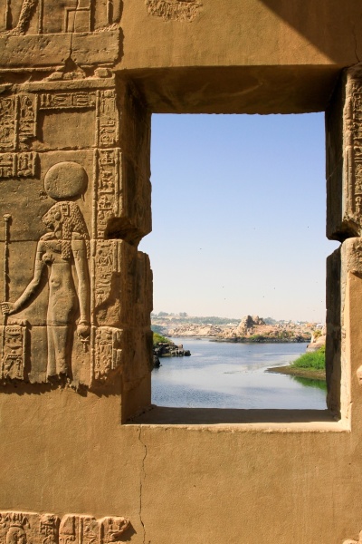 View of water and sky through window framed by hieroglyphics at Philae Temple, Philae, Egypt