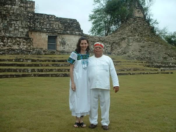 Mena Hunbatz — Althea Provost standing with Hunbatz Men at Dzibilnocac in March 2008, both dressed in traditional white attire before the ancient Maya temple ruins.