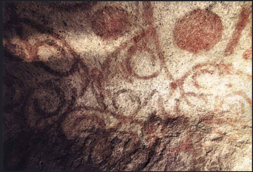 The Oracles of Antiquity: red ochre spiral motifs inside the Ħal Saflieni Hypogeum in Malta, described by Althea Provost; photograph by Damian Entwistle (CC BY‑NC 2.0).