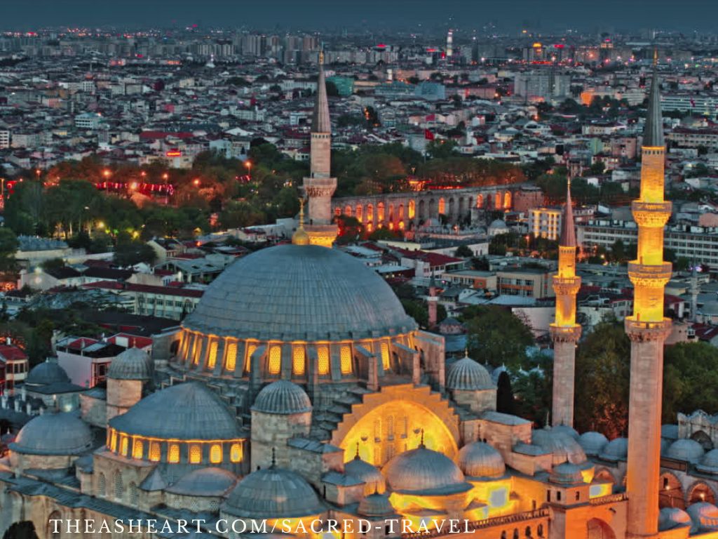 Starseed Türkiye Adventure with Althea Provost: An illuminated mosque rising over the Istanbul cityscape at dusk.