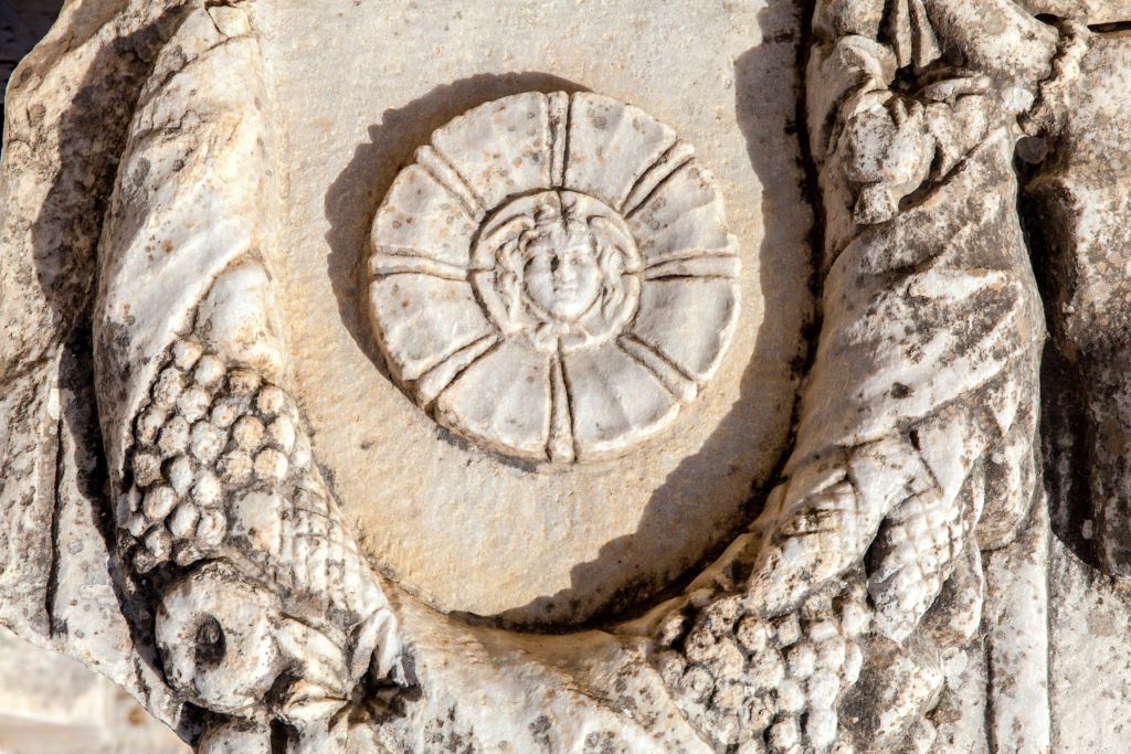 Ancient amphitheater at Miletus explored during the Starseed Türkiye Adventure with Althea Provost, featuring curved stone seating in warm Aegean light.