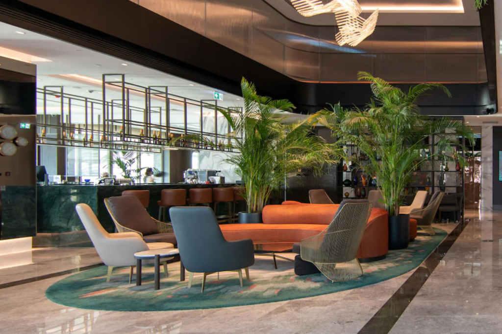 Marriott hotel lobby featured on the Starseed Türkiye Adventure with Althea Provost, showing modern seating and warm lighting.