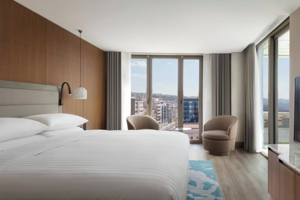 Marriott hotel single occupancy room with city view on the Starseed Türkiye Adventure with Althea Provost, featuring modern furnishings and natural light.