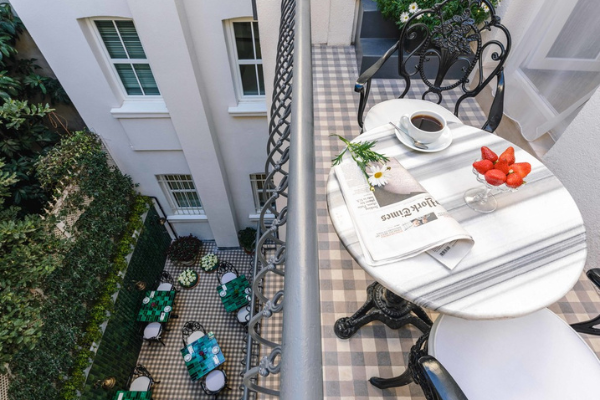 Balcony breakfast scene enjoyed during the Starseed Türkiye Adventure with Althea Provost, overlooking a charming courtyard.