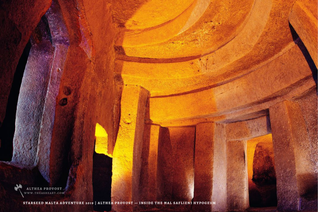 Starseed Malta Adventure 2019 | Althea Provost — interior chamber of the Ħal Saflieni Hypogeum showing carved pillars, rounded ceilings, and warm stone textures.