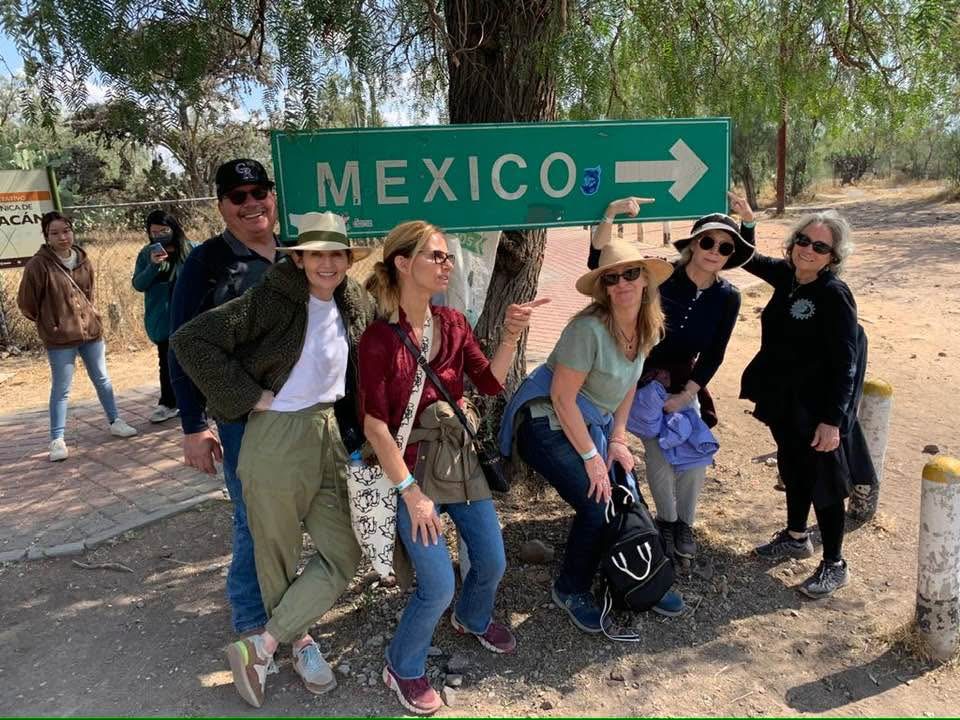 Althea Provost Starseed Mexico Adventure 2023 group photo at Teotihuacan with travelers gathered beneath a Mexico sign, celebrating synchronicity and shared exploration.