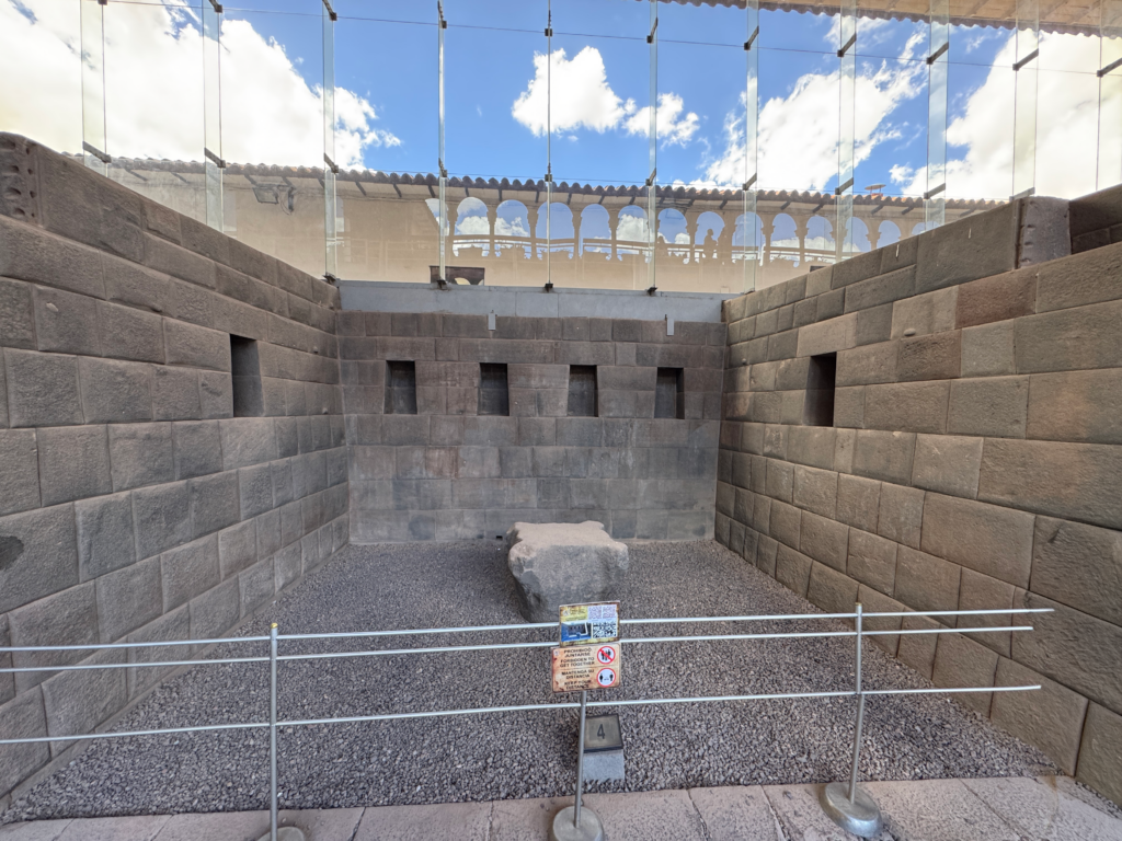 Temple of the Equinox Living Architecture at Coricancha - Thea's Heart Living Architecture expressed through the Temple of the Equinox at Coricancha, showing the precisely fitted andesite walls and central stone feature photographed by Althea Provost during the Starseed Peru Adventure 2025.