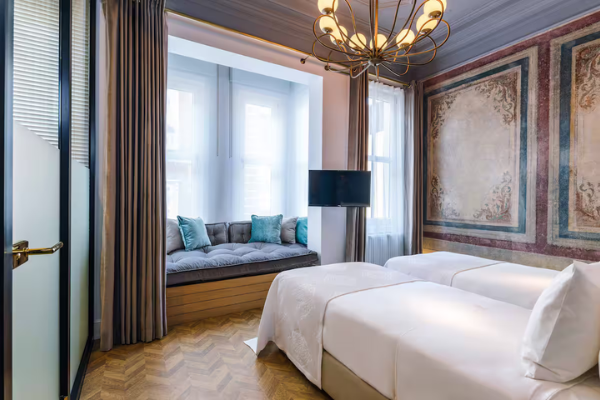 Twin room at The Soul Hotel on the Starseed Türkiye Adventure with Althea Provost, featuring elegant décor and a cozy window seat.