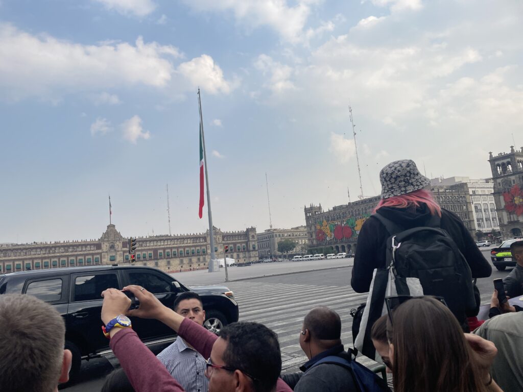 Althea Provost Starseed Mexico Adventure 2023 arriving at Mexico City’s Zócalo with crowds gathered beneath the national flag during the North American Leaders’ Summit.