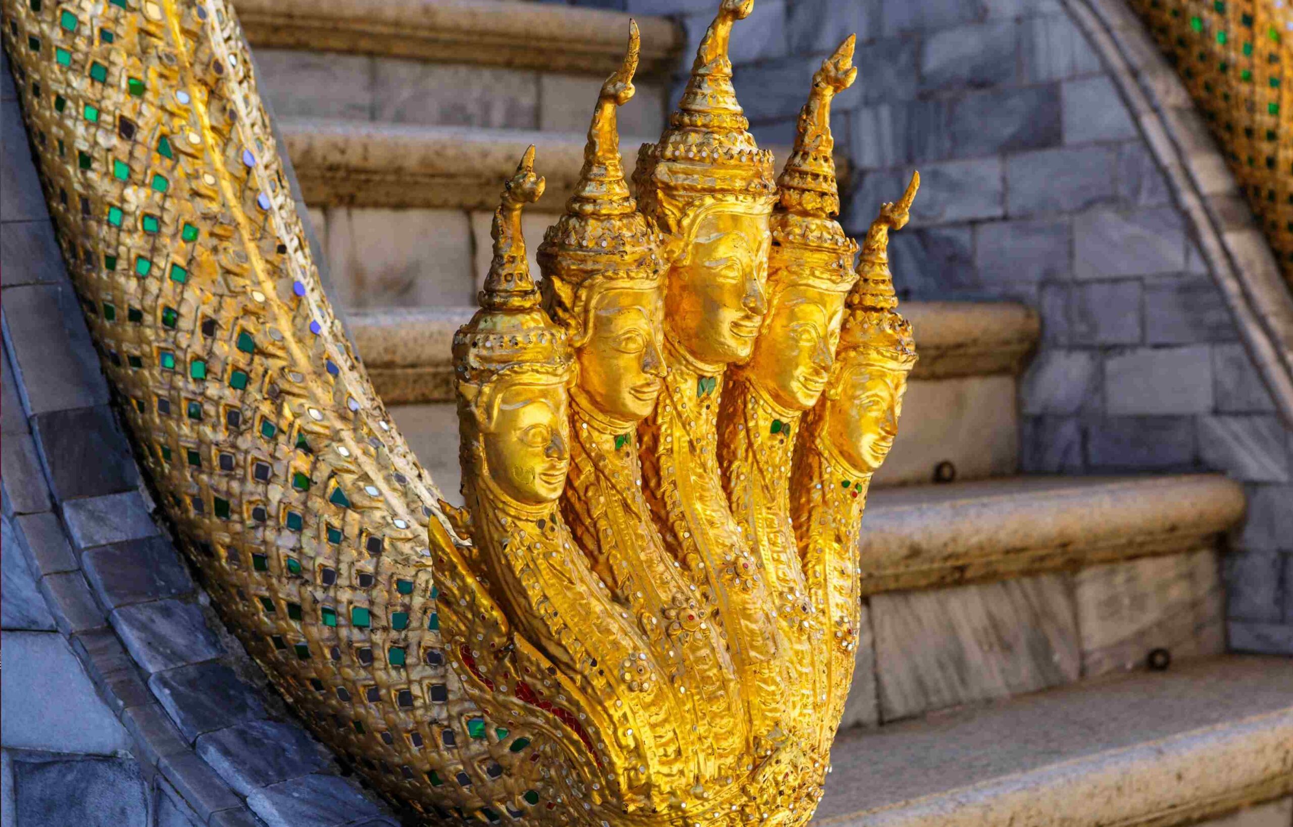 Starseed Bhutan Adventure with Althea Provost golden Naga snake adorning a staircase railing at the Grand Palace Bangkok Thailand