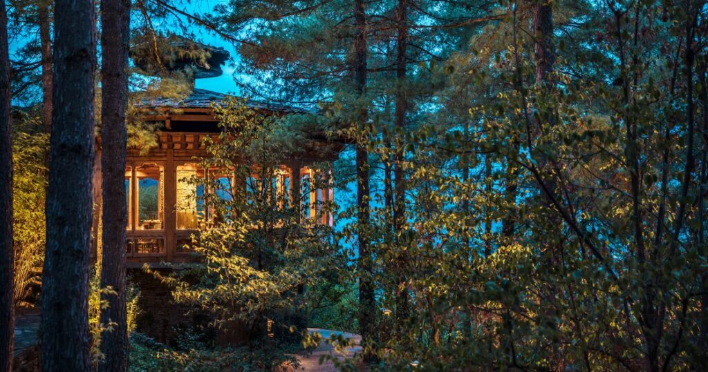 Starseed Bhutan Adventure Como Uma Paro Resort Bukhari Restaurant exterior at dusk.