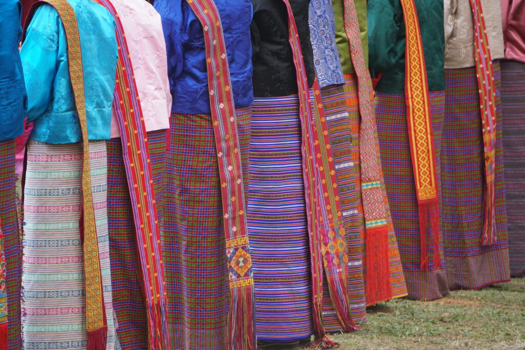 Starseed Bhutan Adventure with Althea Provost women singing in traditional Bhutanese dress in Punakha