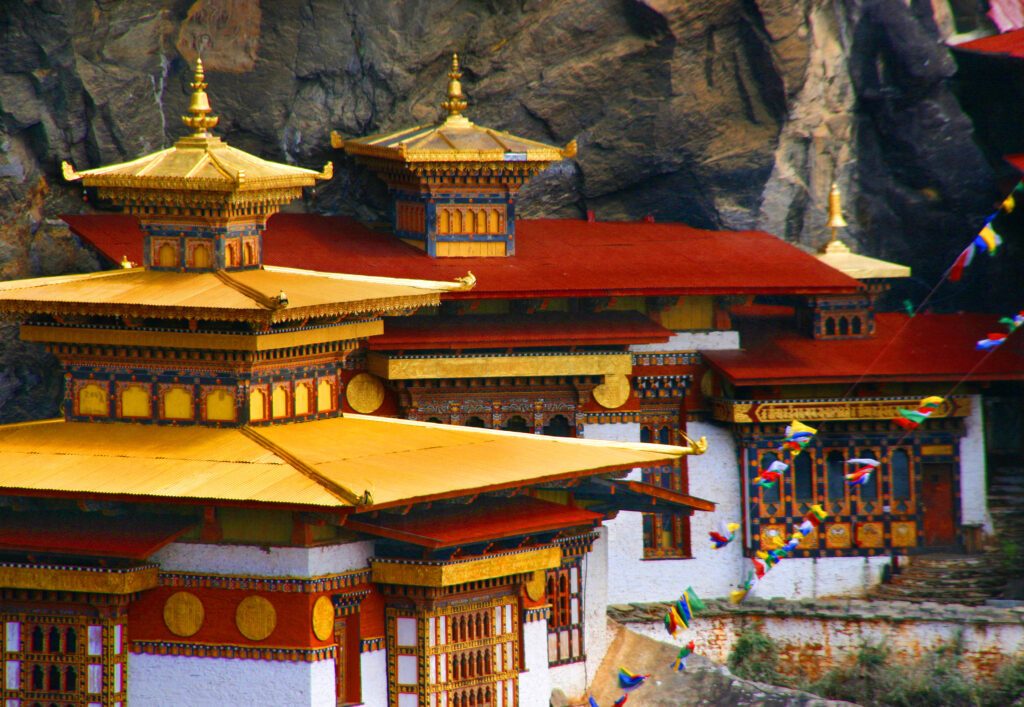 Starseed Bhutan Adventure with Althea Provost golden roofs of Tiger’s Nest monastery, A view of the golden roofs at Tiger’s Nest monastery, Paro Taktsang, in Bhutan.