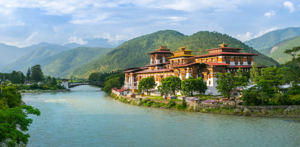 A collage of Bhutan’s landscapes, prayer flags, wildlife, monasteries, markets, and cultural textiles.