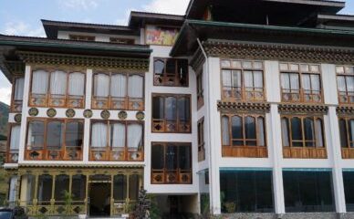 Starseed Bhutan Adventure with Althea Provost — exterior of Tara Haven showcasing modern Bhutanese architecture and intricate woodwork.