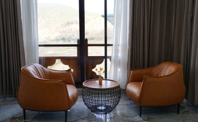 Starseed Bhutan Adventure with Althea Provost — Tara Haven seating area with mountain views and modern leather armchairs.