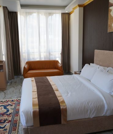 Starseed Bhutan Adventure with Althea Provost — single occupancy room at Tara Haven with warm wood tones, modern decor, and natural light.